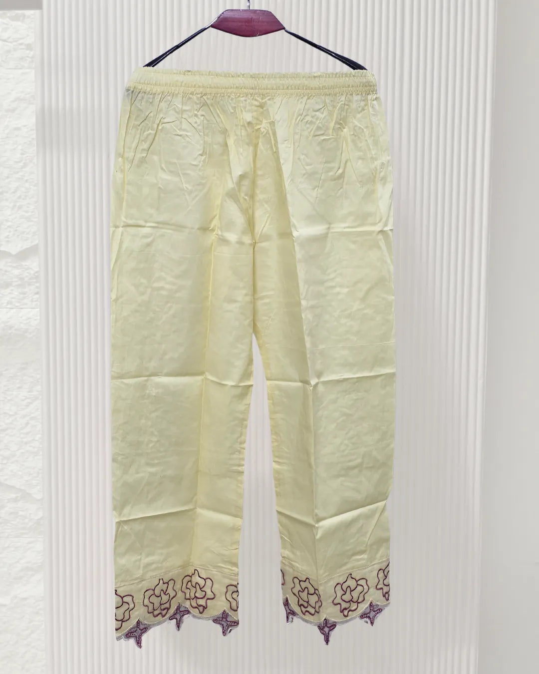 Light yellow pants with floral embroidery