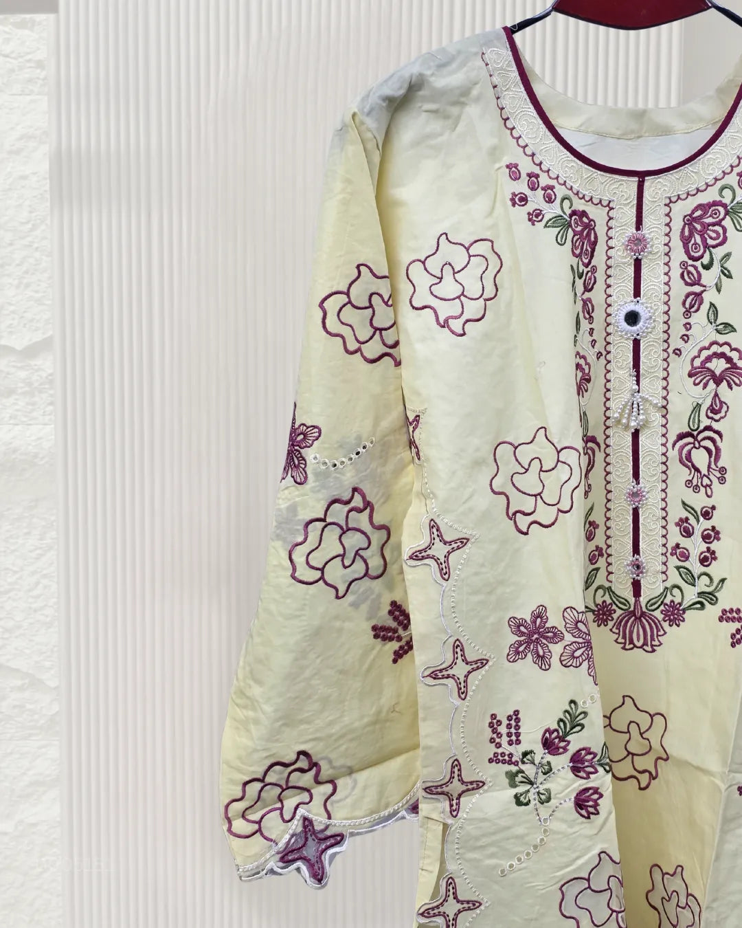 Embroidered garment with floral patterns